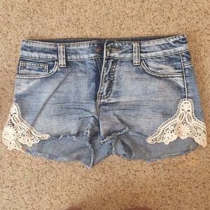 Jean shorts with lace cutouts